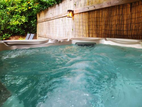 a large pool of water with a wall at Secret Wellness Droombos in Holten