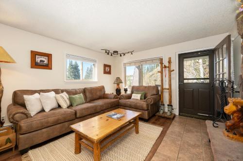 a living room with a couch and a coffee table at Hi Country Haus Unit 1515 in Winter Park