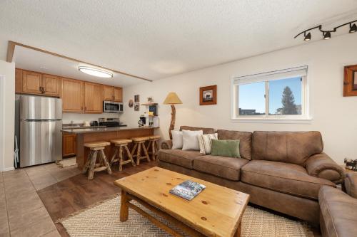a living room with a couch and a table at Hi Country Haus Unit 1515 in Winter Park