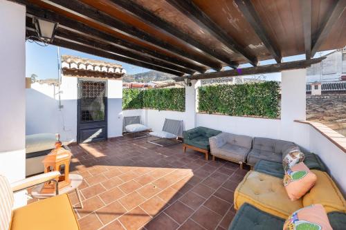 a living room with a couch and a fireplace at Apartamentos - PinkSparrow - in Granada