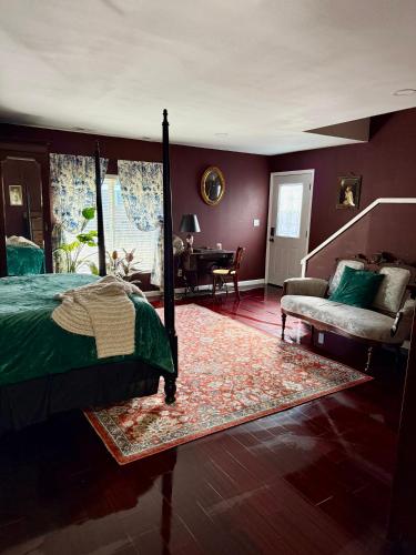 a bedroom with a bed and a living room at Lafayette's Oldest Church in Lafayette