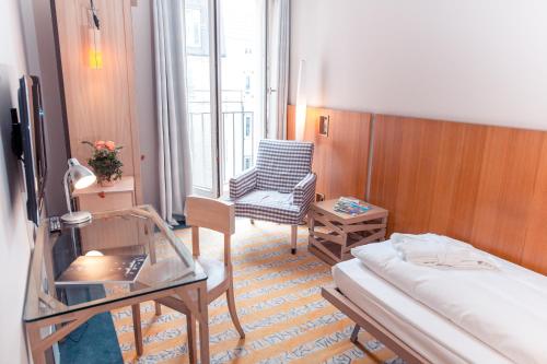 TV a/nebo společenská místnost v ubytování Hotel Bleibtreu Berlin by Golden Tulip