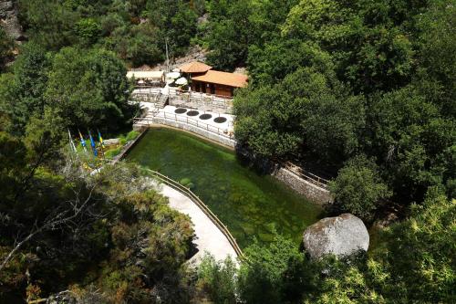 an aerial view of a bridge over a river at Recanto da Neta in Seia