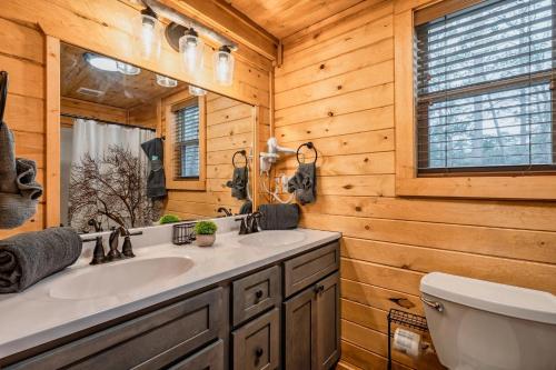 a bathroom with a sink and a toilet at 3 Bed2 King4 Singlegame Rmhot Tbdog Friendly in Waldens Creek