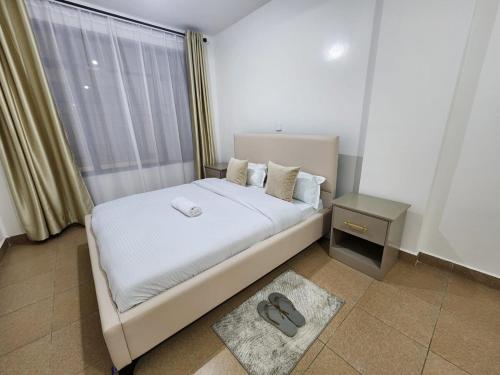 Ένα ή περισσότερα κρεβάτια σε δωμάτιο στο Modern 2 Bed All Ensuite Near Nakuru CBD