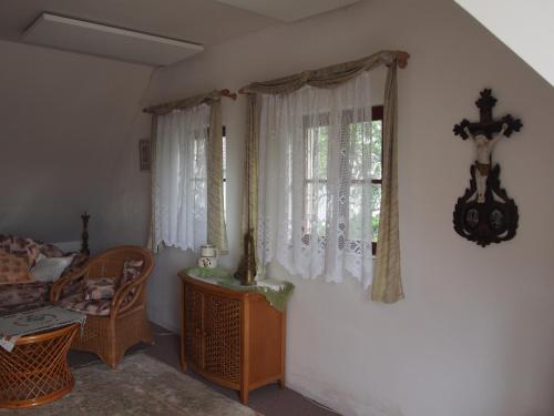 a living room with a couch and a window at Kopaniny in Kopaniny