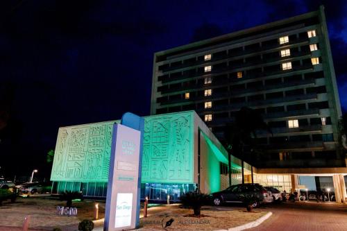 a blue building with a building with a building at San Diego Suites Veredas Sete Lagoas in Sete Lagoas