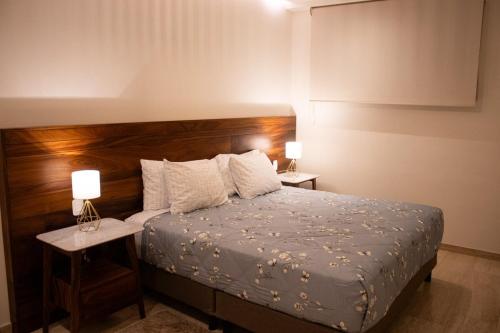 Ένα ή περισσότερα κρεβάτια σε δωμάτιο στο Mistiq Cabo Condominium with Style and Comfort