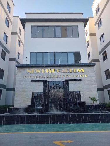 a building with a fountain in front of a building at Imani Homes in Nairobi