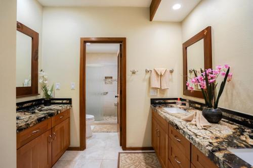 a bathroom with two sinks and a toilet at Lanikai #212 in Wailua