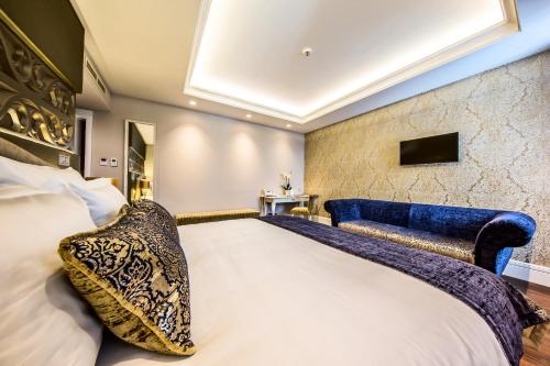 Ένα ή περισσότερα κρεβάτια σε δωμάτιο στο Prestige Hotel Budapest