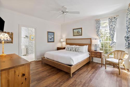 a bedroom with a bed and a desk and a chair at MH3012: 3012 Marsh Haven in Seabrook Island
