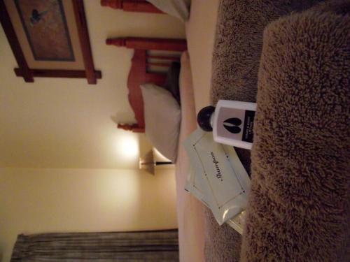 a corner of a room with a door with a book at Jock-Sabie Lodge in Sabie