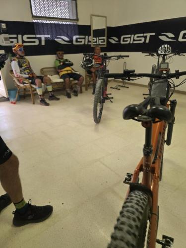 a group of people sitting in a room with bikes at Tenuta Lo Cuoccio in Gravina in Puglia