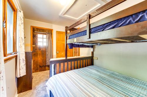 a bedroom with two bunk beds in a room at Rustic Bedford Cabin Near Hunting and Fishing in Bedford