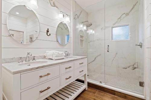 a white bathroom with a sink and a shower at SM09: 9 Silver Moss in Kiawah Island