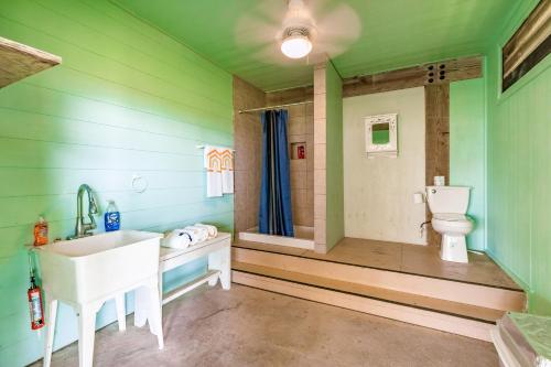 a bathroom with a sink and a toilet at Ultimate Beachfront Beach Access Fenced Yard in Hercules Offshore Heliport