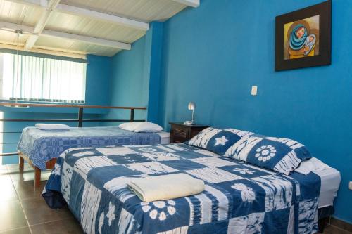 Postel nebo postele na pokoji v ubytování Hostal Casa del Sol Apartamento