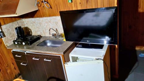 Una cocina o zona de cocina en El Lapacho Cabañas