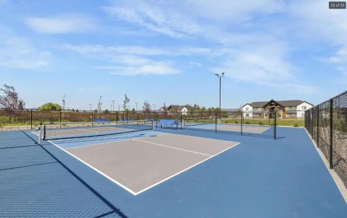 a tennis court with two tennis courts at Teton Mountain Nest in Driggs