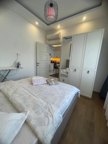 a bedroom with a large bed and a mirror at kestel city in Alanya