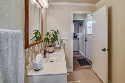 a bathroom with a sink and a mirror at Walk to River Oacoma Home with Dog-Friendly Yard! in Oacoma