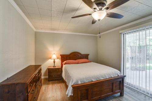 a bedroom with a bed and a ceiling fan at Walk to River Oacoma Home with Dog-Friendly Yard! in Oacoma