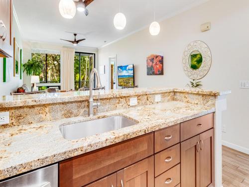 a kitchen with a sink and a window at Wailea Grand Champions 183 in Wailea