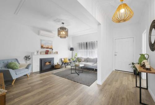 a living room with a couch and a fireplace at Eureka We struck a golden home in Eureka