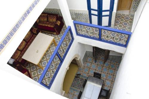 an overhead view of a living room with blue stairs at Dar Gentille in Essaouira