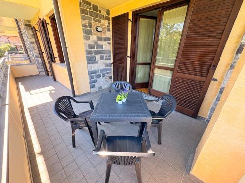 a table and chairs sitting on a patio at Casa Sole, 10 minutes from Lake Como in Lurate Caccivio