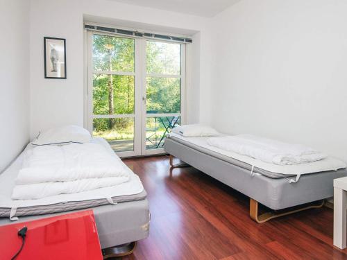 Postel nebo postele na pokoji v ubytování 10 person holiday home in Ebeltoft-By Traum