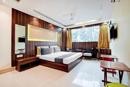 Ένα ή περισσότερα κρεβάτια σε δωμάτιο στο Super Collection O Motisarai