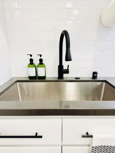 a kitchen sink with two bottles on it at Modern 2BR Guest Suite with Kitchen, Free Parking, Fire Pit - 10 mins to SJC in San Jose