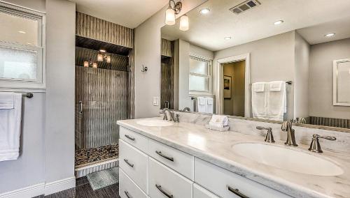 a bathroom with two sinks and a shower at Siesta Sunset - 524 (PH) in Siesta Key