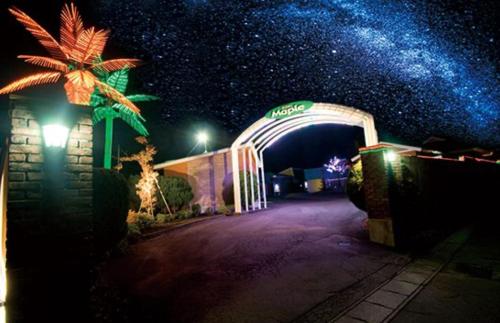 a night scene of a tunnel with a starry sky at ホテルメイプル in Odate