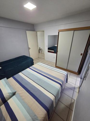 Postel nebo postele na pokoji v ubytování Apartamento Itaimbe - Centro - Garagem