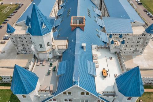 an overhead view of a building with blue roof at Extravagant 3 Level Penthouse at The Grand Castle in Grandville