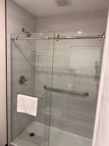 a shower stall with a glass door in a bathroom at SOFI MOTEL in Los Angeles