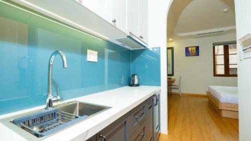 Giường trong phòng chung tại La Maison De Dino Hotels & Apartments Phú Quốc