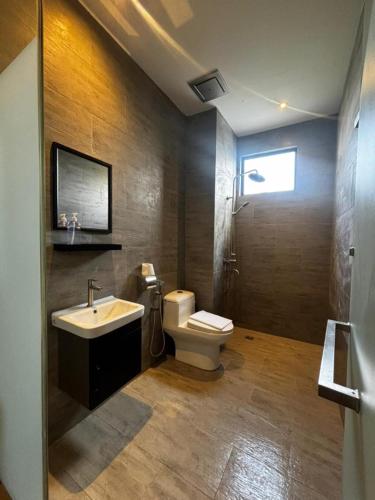 a bathroom with a toilet and a sink at iBilik Hotel - KLIA 1 KLIA 2, Sepang in Sepang