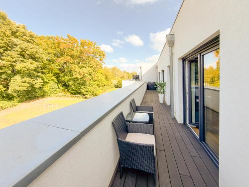 Foto ImmoStay #3 - Penthouse mit zwei Balkonen & Seeblick, Parking & WiFi 1
