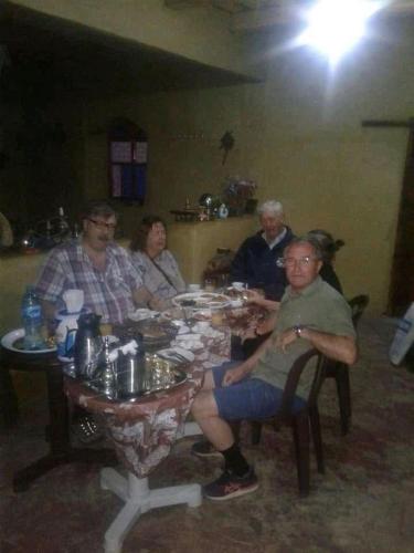 a group of people sitting at a table at دار اوليم in Annoums