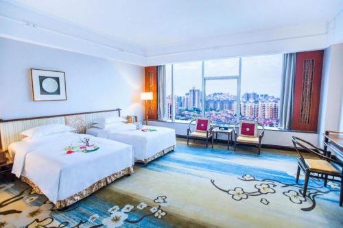 Postel nebo postele na pokoji v ubytování Lai shing Holiday Resortel