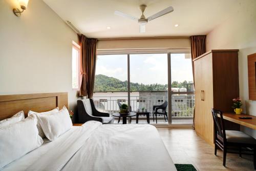 Ένα ή περισσότερα κρεβάτια σε δωμάτιο στο Neelkanth - The Himalayan View Abode