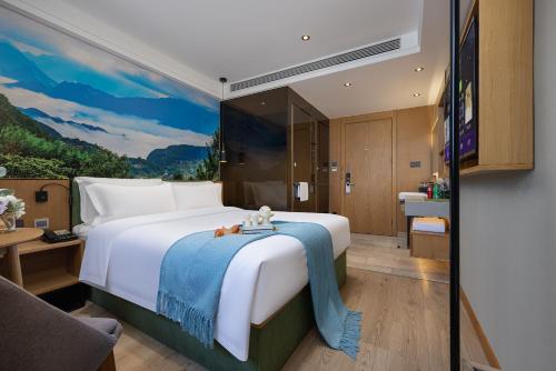 Ένα ή περισσότερα κρεβάτια σε δωμάτιο στο Qiuguo Hotel, Beijing West Railway Station Liuliqiao East Subway Station