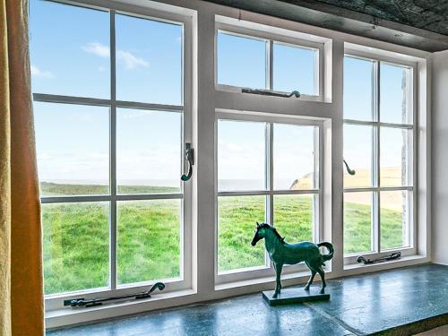 a statue of a horse in front of a window at Wharrastone - Uk50661 in Crackington Haven