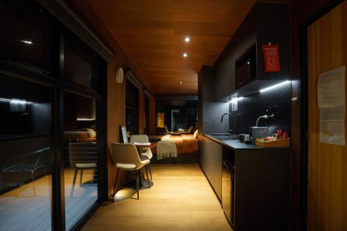 a hallway with a kitchen and a room with a bedroom at AUTRA Resort Lyndoch in Lyndoch