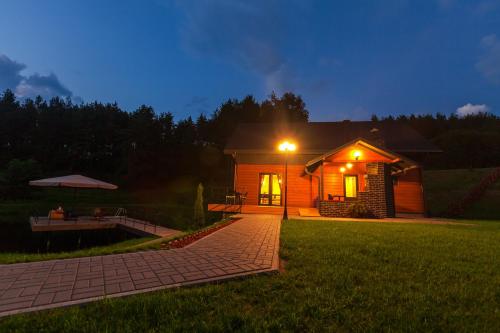 a house with a light on the side of a yard at Anupro Villa in Trakai