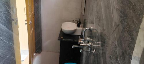 a bathroom with a sink and a toilet and a shower at Valley vibes by Bahugunas den in Srīnagar